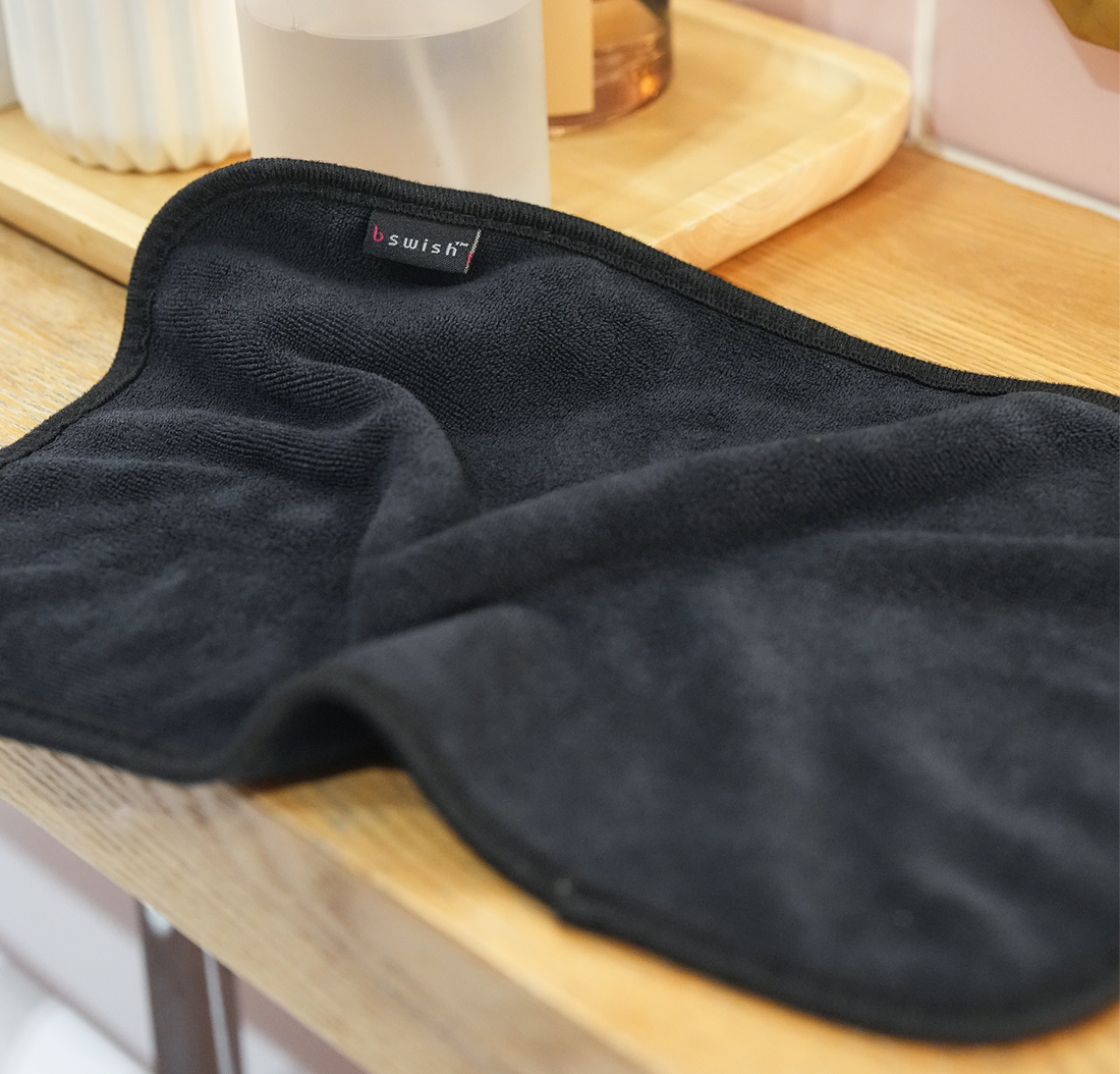 A soft black after-sex towel ready for Post-Intimacy clean-up.